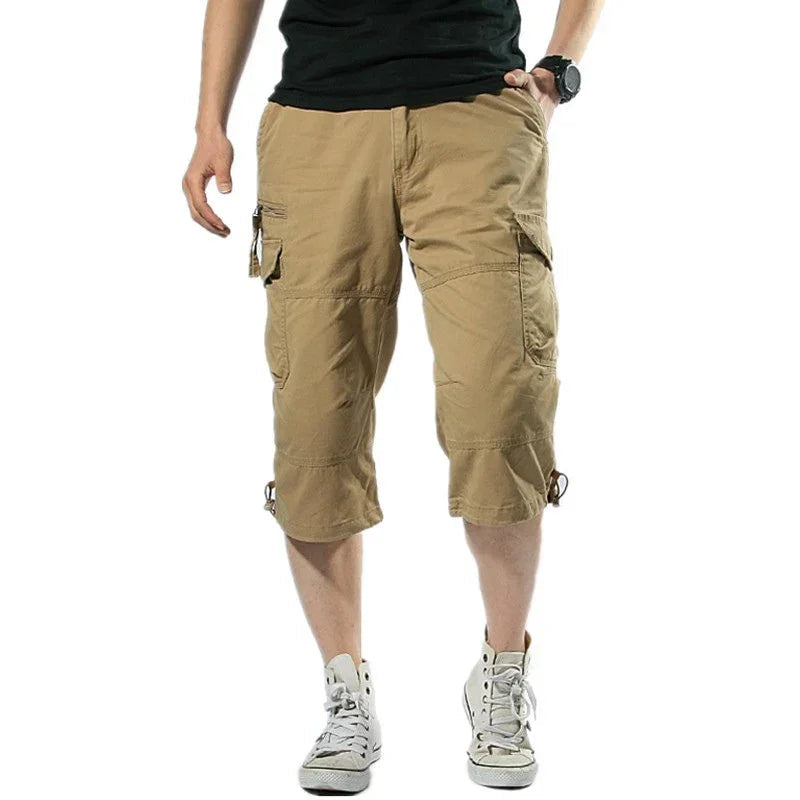 Men's long cargo shorts with utility pockets and toggle hems