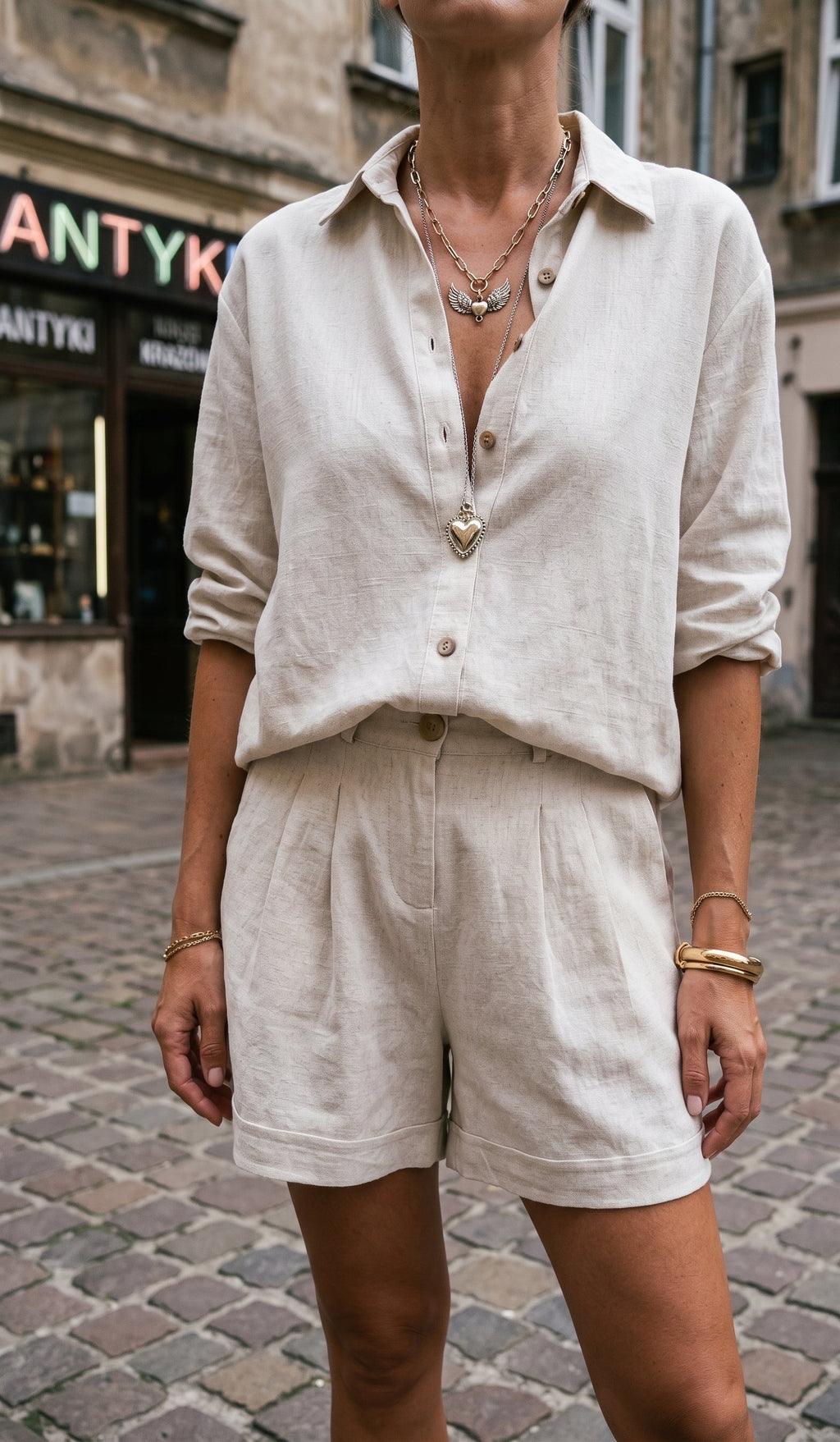 Women's collared button-front blouse and pleated shorts set