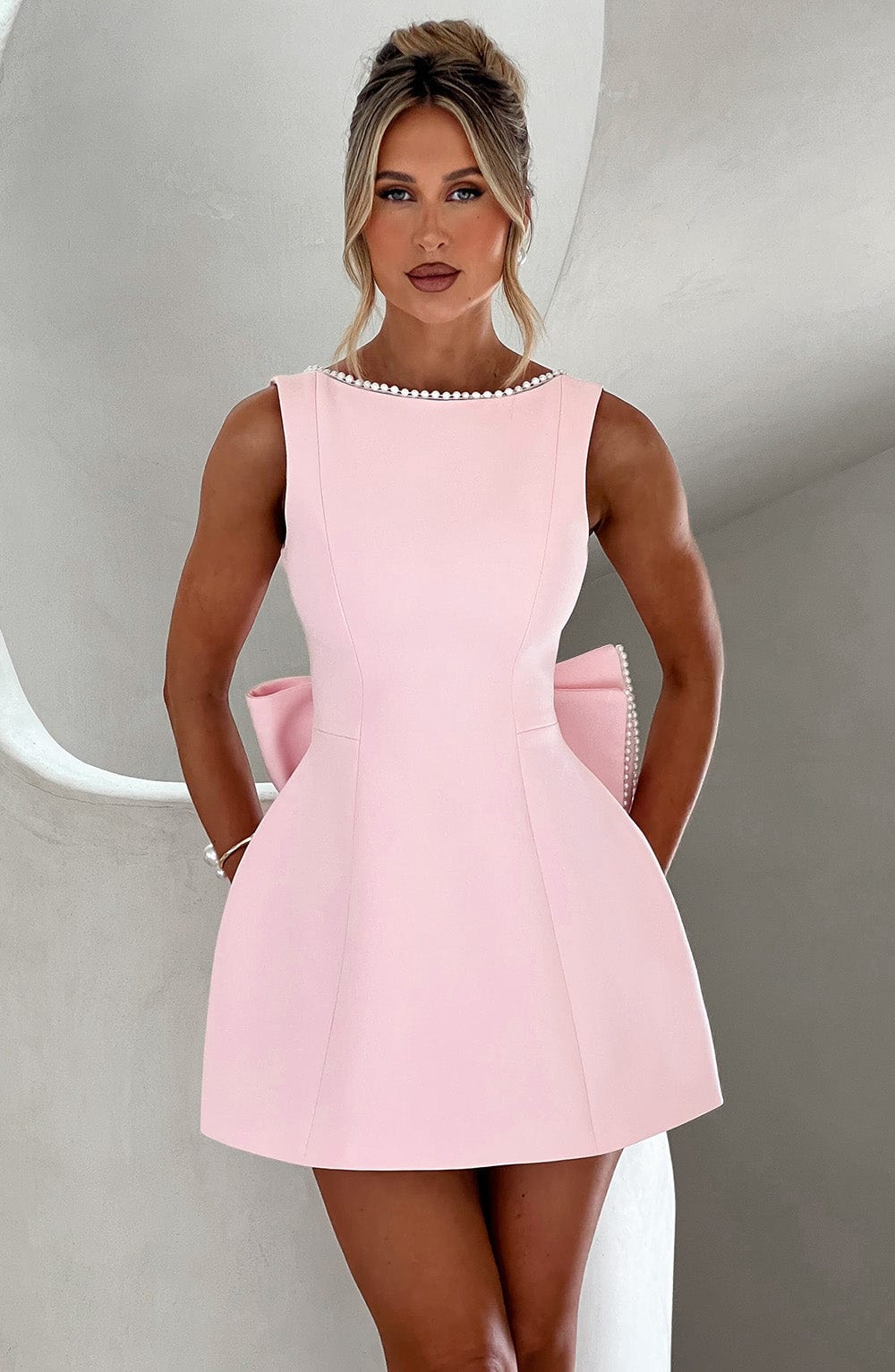 Women's sleeveless A-line mini dress with pearl trim neckline